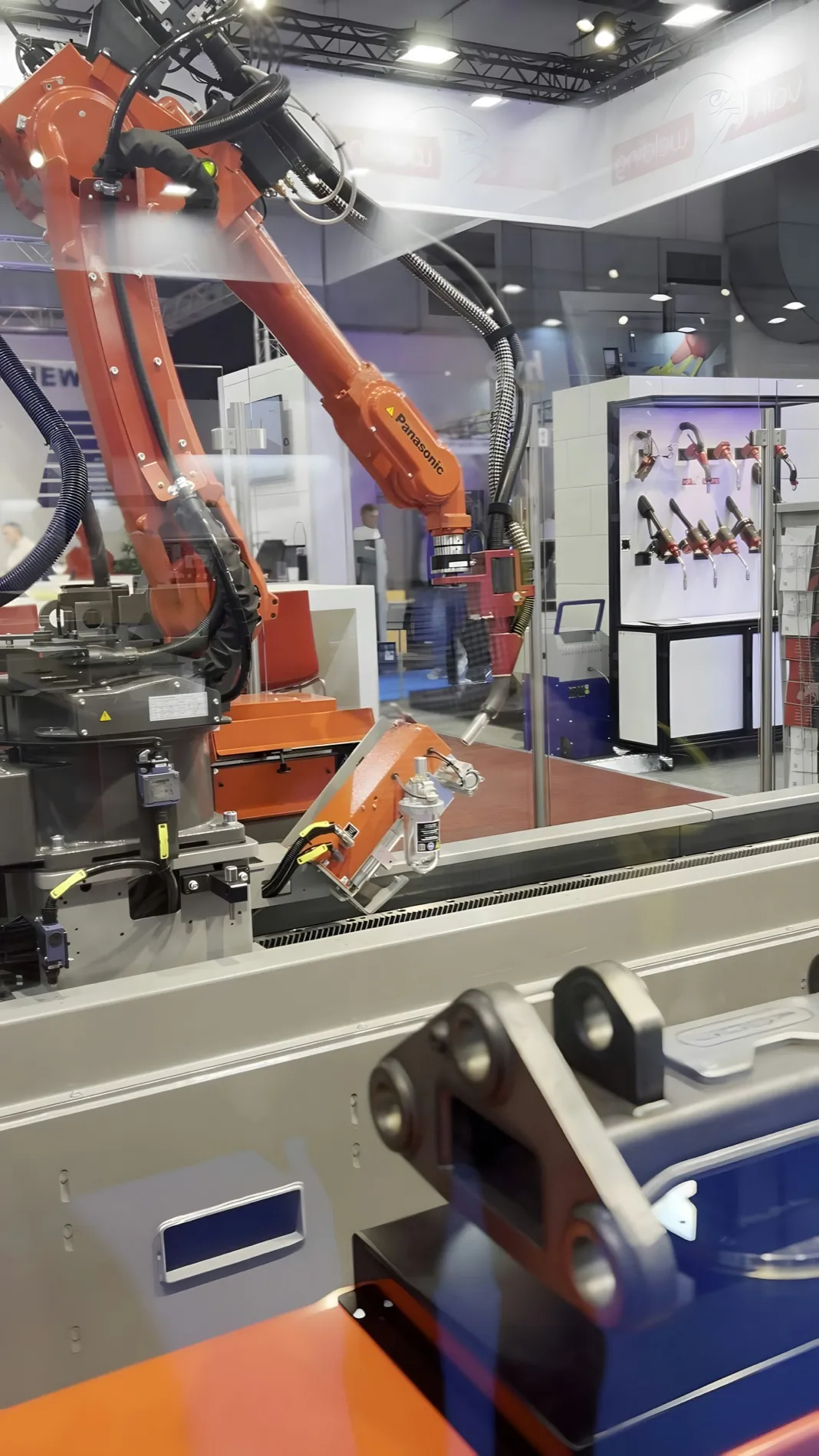 Robot arms working over a moving line
