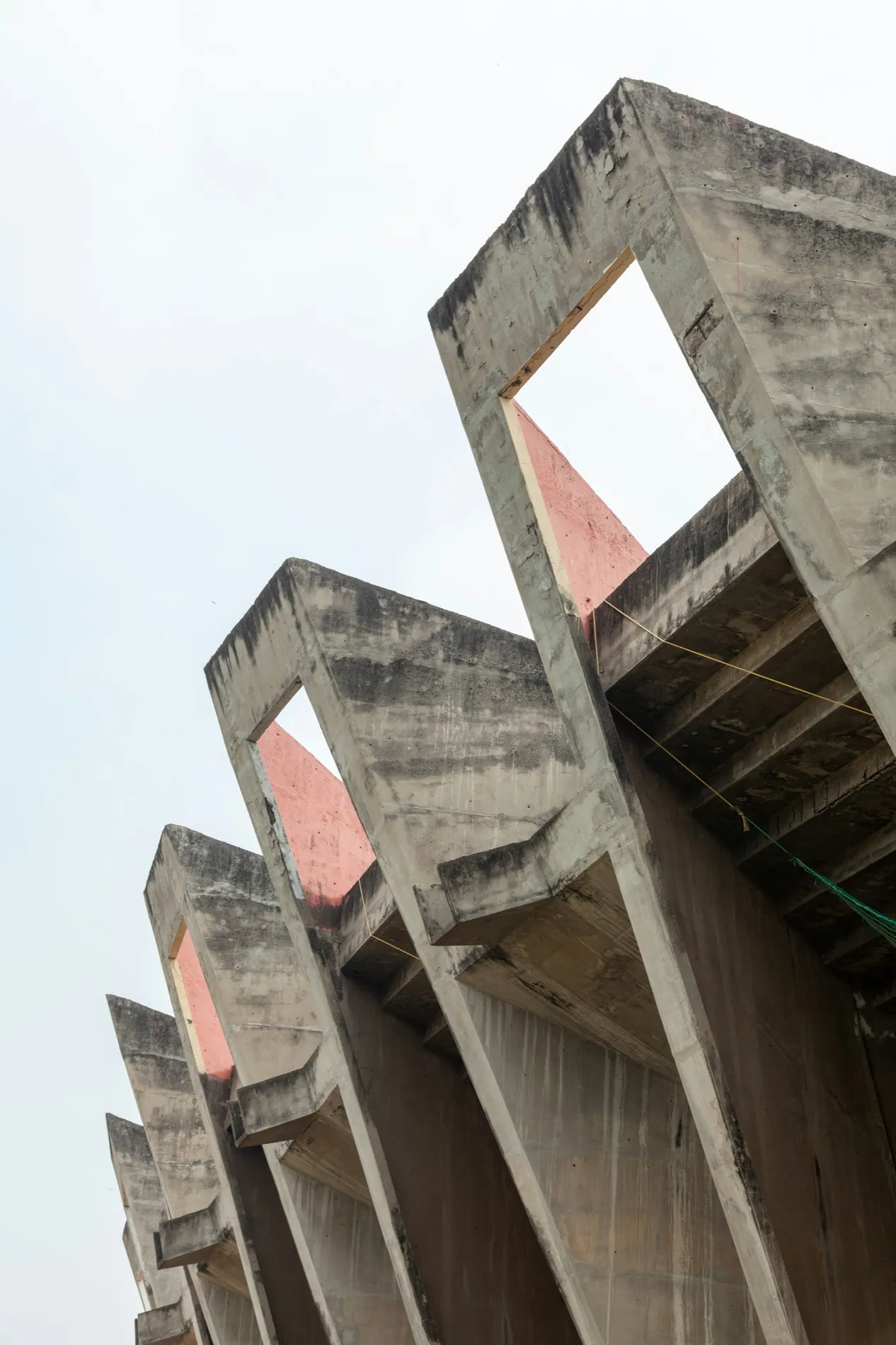 Concrete spans cantilevered out against a bare sky